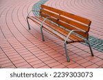Small photo of Hostile architecture. Bench with metal armrests designed to stop people laying down. Defensive architecture.