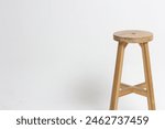 The long round wooden chair is...