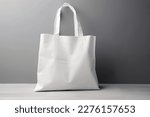 Small photo of Blank canvas tote bag mockup in white eco friendly design with copy space. Concepts for zero waste movement of shopping bags.