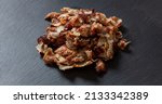 Small photo of Shawarma gyro. Greek, Turkish traditional meat food on black color background, above view. Ethnic dish, meat cut into thin slice, Middle East popular street food