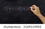 Small photo of Pi number, mathematical constant chalk drawing on a school black board, Male hand write decimal digits with a chalk