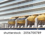 Small photo of IJmuiden, The Netherlands - october 8th, 2021: Spirit of Adventure Saga Cruises, detail of lifeboats and balcony staterooms