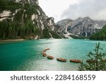 Lake Braies (Lago di Braies, Pragser Wildsee) in Dolomites Alps, South Tyrol. Best touristic place in Dolomites. Lake with typical rowing wooden boats.