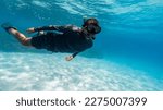 Young man snorkeling in the...