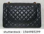 Photo of black classic handbag closeup - Image