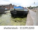 Small photo of June-13-2018, British Waterways Museum, Cheshire, UK. The Barge BACUP at rest.