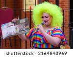 Small photo of Saint John, NB, Canada - June 5, 2022: A drag queen reads children's stories at the Drag Story Hour in Market Square.
