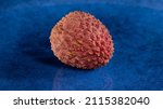 fresh lychee fruits on blue... | Shutterstock . vector #2115382040
