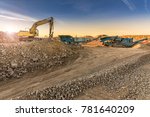 Small photo of Excavator and machine to pulverize stone in a quarry
