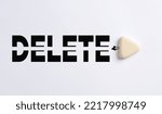 Small photo of To clear the past, delete problems and correct mistakes in business or education concept. White eraser erases the word delete on white background.