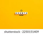 White letter blocks on yellow background with the word growth hacking. Growth hacking in marketing and business concept.