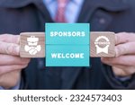 Small photo of Businessman holding colorful blocks and sees inscription: SPONSORS WELCOME. Sponsor and sponsorship concept. Crowdfunding.