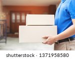 Small photo of parcel delivery man of a package through a service send to home. consign hand Submission customer accepting a delivery of boxes from delivery man.