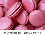 Set of Many tasty macarons purple pink on bright background. a pattern of colorful french cookies. homemade food.