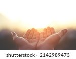 Small photo of Human hands open palm up worship Praying with faith and belief in God of an appeal to the sky. Concept Religion and spirituality with believe Power of hope or love and devotion. filler tone vintage.