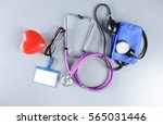 red heart and a stethoscope on... | Shutterstock . vector #565031446