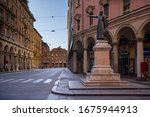 Small photo of BOLOGNA, ITALY - MARCH 2020: Ugo Bassi street and statue in a deserted city due to Covid-19 virus. Bologna is the largest city and the capital of the Emilia-Romagna Region in Italy.