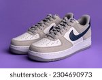 Small photo of ROME - MARCH 2023: Brand new Nike Air Force One sport shoes isolated. Nike is one of the world's largest suppliers of athletic shoes. The company was founded in 1964. Illustrative editorial.
