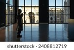 Small photo of MILAN, ITALY - DECEMBER 19, 2023: Tourist inside Museo del Novecento (Museum of the Twentieth century), in Palazzo dell Arengario in Milan.