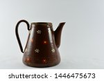 Small photo of Hillegom, Netherlands - July 05 2019: Coffee/Tea pot made from unused grenades.Germany 1945 after the war.Brown enamel.