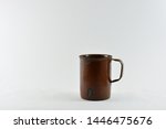 Small photo of Hillegom,Netherlands-July 05 2019: tea/coffee mug made from unused grenades.Germany 1945 after the war.Brown enamel.