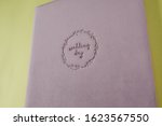 Small photo of Inscription WEDDING DAY supplanted on velour wedding book.