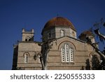 Landscape with scenic view of Panaghitsa a royal church with a large dome and vaulted arches  on the coastal road of Aegina island in Greece. 