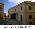 Small photo of April 23, 2023. Scenic exterior view of Circolo Embedocleo the Agrigento Cultural Center with the Neoclassical facade the nine Doric semi-columns, the tympanum and frieze in Sicily, Italy.
