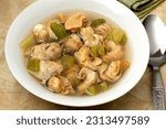 Small photo of Dish with Common whelks in broth as a Brussel soup close up for a meal