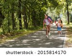 Small photo of Primary school pupil. boy and girl with backpacks walking down street. Happy children happy to go back to school. beginning school year. Kids are happy to run to school. education.
