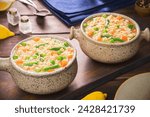 Small photo of Middle Eastern delicious vegetable orzo soup. It's hearty comforting and one of the best soup recipes. Served with lemon and garnish with fresh thyme.