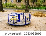 Small photo of Photography on theme empty playground with metal swing for kids on background natural nature, photo consisting from playground with steel swing, swing on old playground in countryside without people