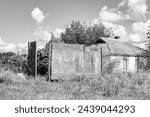 Small photo of Beautiful old abandoned building farm house in countryside on natural background, photography consisting of old abandoned building farm house at wild grass, old abandoned building farm house over sky