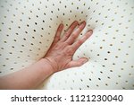 perforated latex mattress and pillow texture with hand on it