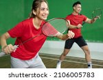 Mixed doubles badminton player with stance position ready to play