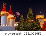 Fairy-tale decorative buildings and a Christmas tree on Republic Square in Yerevan. The flag of Armenia on the roof of the government building. Christmas and New Year.Armenia
