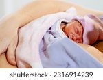Small photo of Freshly premature baby born skin to skin on unrecognizable mothers chest caucasian female newborn first breath of life Kangaroo care with skin to skin contacthealthy relieved mother baby.