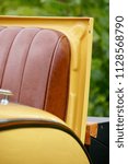 Small photo of New Britain, Connecticut/USA- June 6, 2015: A vertical image of the rear rumble seat of a vintage automobile at an antique car show.