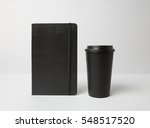 Black paper cup and moleskin 
