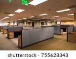 Small photo of An empty office space with furnished cubicles ready to be occupied.