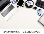 Small photo of Top view to old laptop computers, digital tablets, mobile phones, many used electronic gadgets devices on white background. Planned obsolescence, electronic waste for recycling concept