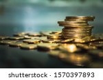 Gold coins stacks is representing riches and wealth management. Coin stack growing and find out the way to get a return on investment. Finance and money exchange investment as concept.