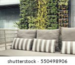 Beautiful vertical garden with outdoor sofa for family relaxing zone