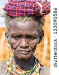 Small photo of OMO VALLEY, ETHIOPIA - AUG 15: Erbore elder posing in the village,the ethnic groups in the The Omo valley Could disappear Because of Gibe III hydroelectric dam. on Aug 15, 2011 in Omo Valley, Ethiopia.