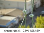 Small photo of Rope lockers in of suspended wire rope platform for facade works on high multistorey buildings. Rope lockers blocks rope kink for safety platform usage