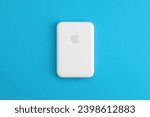 Small photo of KYIV, UKRAINE - OCTOBER 31, 2023 Apple MagSafe battery device for iPhone charging via magnet connection. Mag Safe modern portable power bank device