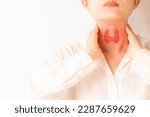 Small photo of Female checking thyroid gland by herself. Close up of woman touching neck with thyroid gland organ. Thyroid disorder includes goiter, hyperthyroid, hypothyroid, tumor or cancer. World Thyroid Day.