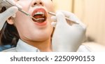 Dentist examining teeth...
