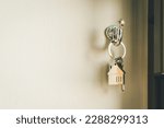 Small photo of House model and key in house door. Real estate agent offer house, property insurance and security, affordable housing concepts