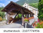 Historic wooden bridge over the Dranse in Orsières, Valais, Switzerland